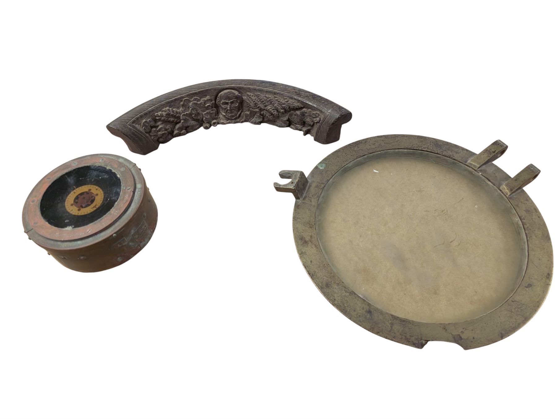 Military issue 02A gimbal compass, with broad arrow mark, together with a brass porthole and a piece of wood carved with portrait and foliage