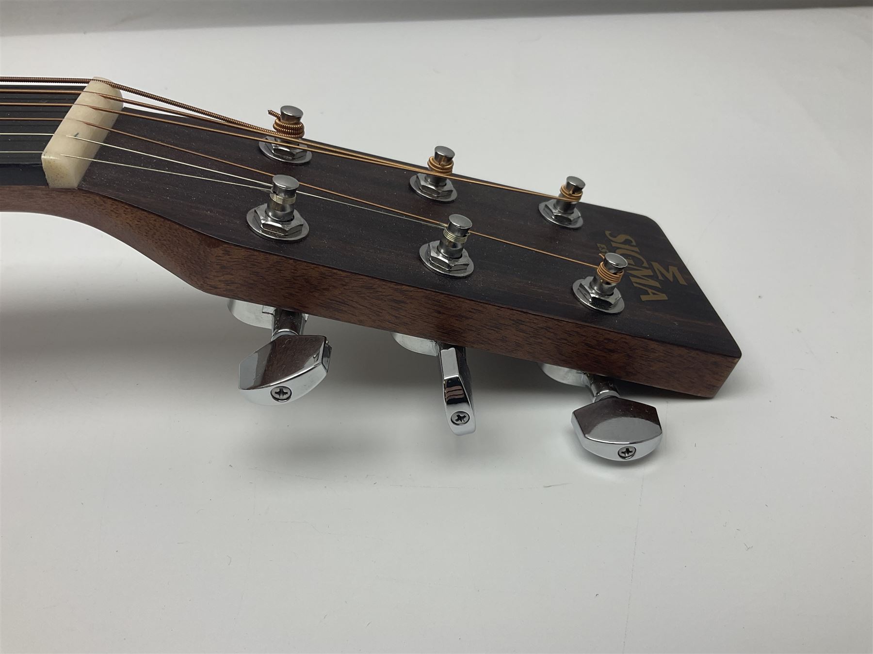 Sigma GMC-1E semi-acoustic guitar with cut-away body, sapele mahogany back and ribs and solid spruce top; bears label Model GMC-1E serial no.210522747; L103cm