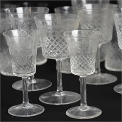 Suite of early 20th century cut and etched table glass comprising nine tumblers, ten smaller tumblers, eleven small wine glasses, six sherry glasses and water jug together with four other sherry glasses