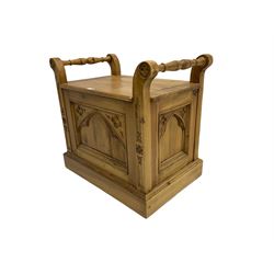 Gothic style pine stool with hinged box seat, decorated with flower head motifs, plinth base