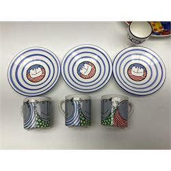 Modern studio pottery by Josie Firmin, to include cup and saucer, three espresso cups and saucers, pair of egg cups etc, each hand painted with varying cartoon cat designs
