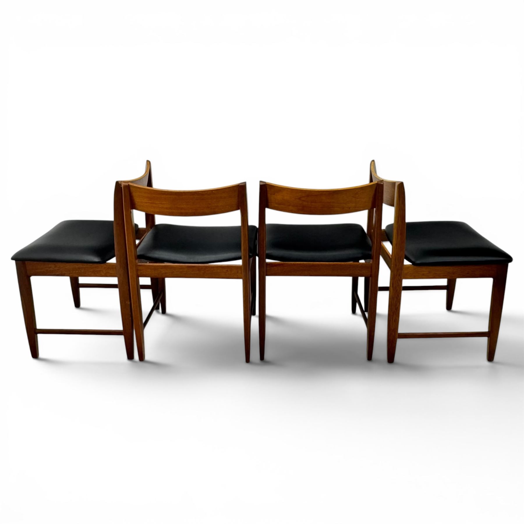 BCM (Bath Cabinet Makers) - mid-20th century teak extending dining table with BCM set of four teak dining chairs with bar back and black vinyl seats