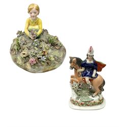 Crown Staffordshire figure modelled as a child in a garden, modelled by T Bayley, H15cm and Victorian Staffordshire figure group of St George and the Dragon, H19cm 