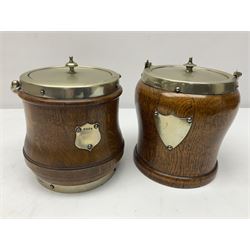 Five early 20th century biscuit barrels with silver-plated mounts, one made from Mahogany from HMS Hindustan