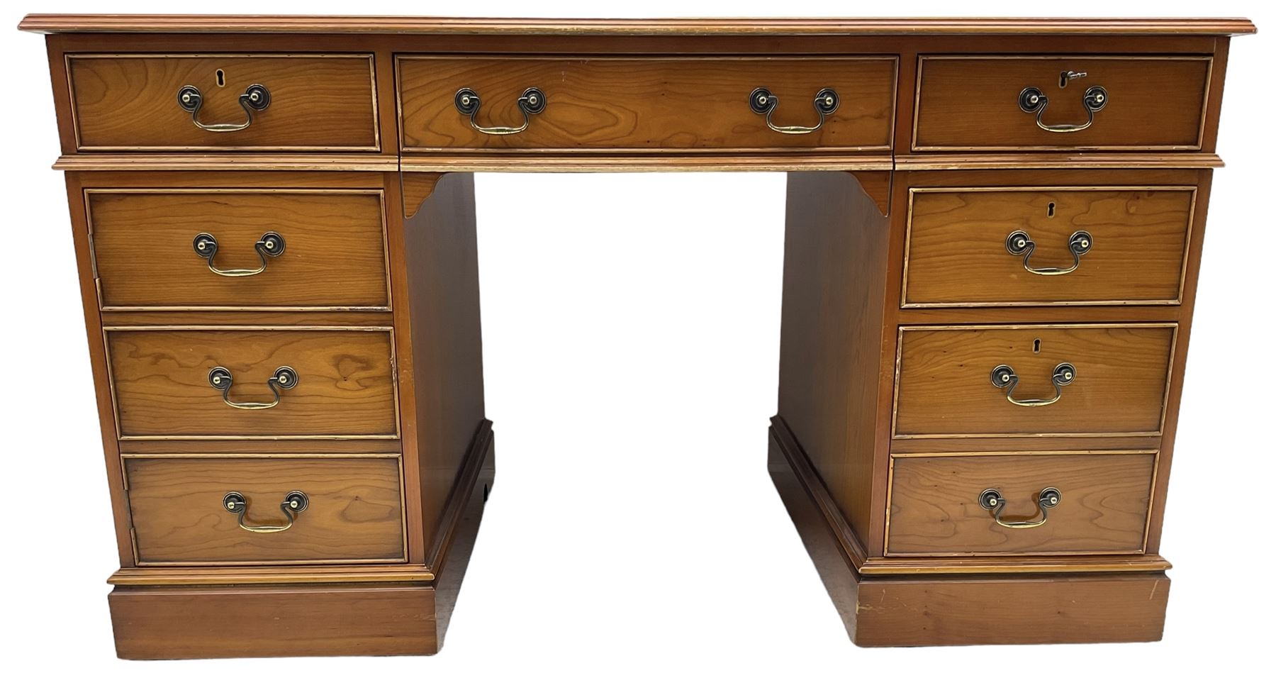 Cherrywood twin pedestal desk, rectangular leather inset top over central fall front with keyboard slide and two drawers, fitted with two drawers and cupboard, on bracket feet