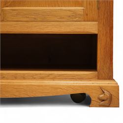 Unicornman - Yorkshire oak media cabinet, rectangular top over a pair of panelled cupboard doors with brass handles, open undertier, on shaped bracket supports above castors