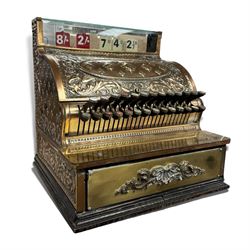 Early 20th century copper and brass till, embossed throughout with relief floral and acanthus leaf decoration, made by The National Cash Register Company Dayton Ohio USA, H46cm