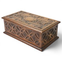 Elizabethan Revival style oak bible box, the central oval boss surrounded with carved stra...