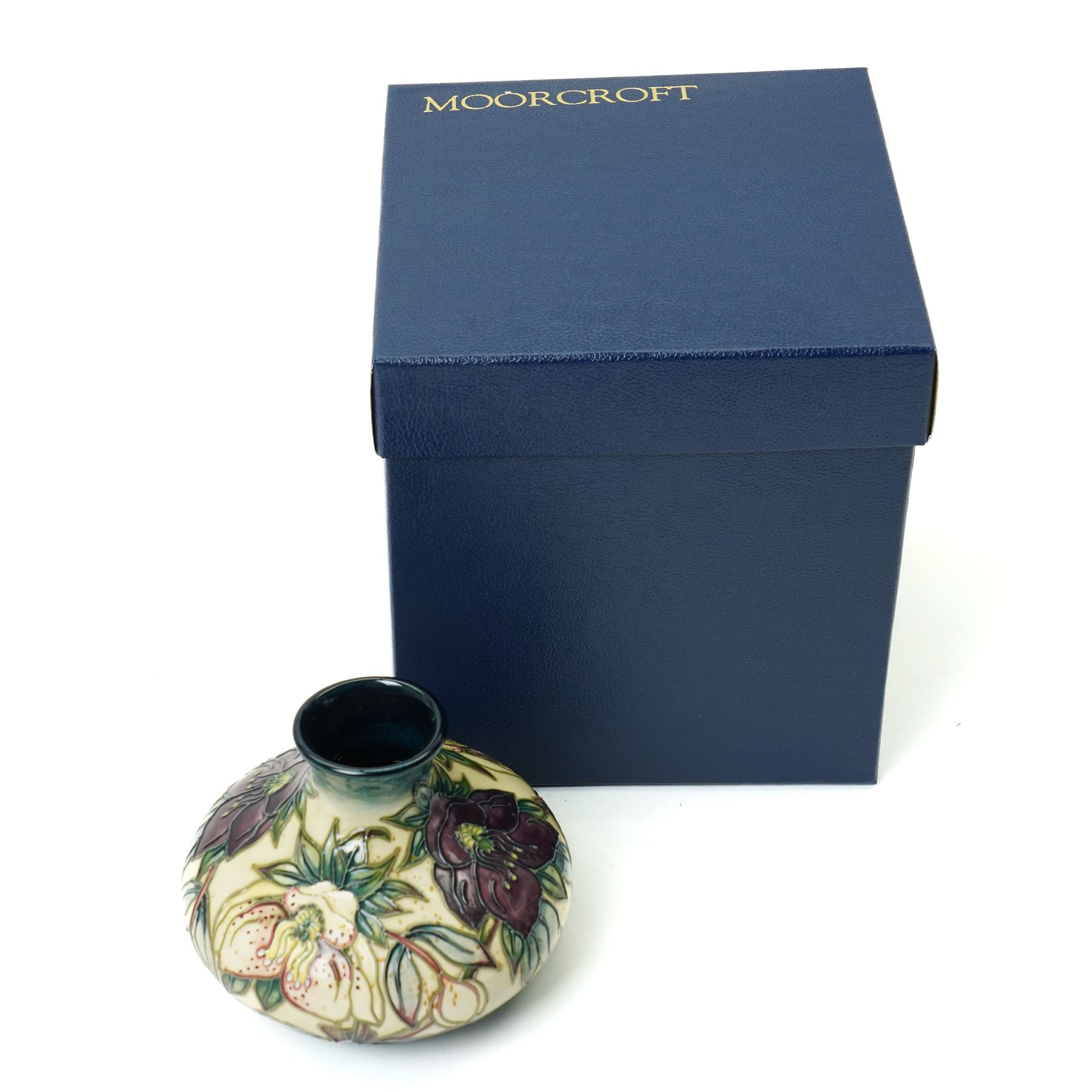 Moorcroft Hellebore pattern vase, of squat baluster form, with impressed and painted marks to base, in original box, H10.5cm 