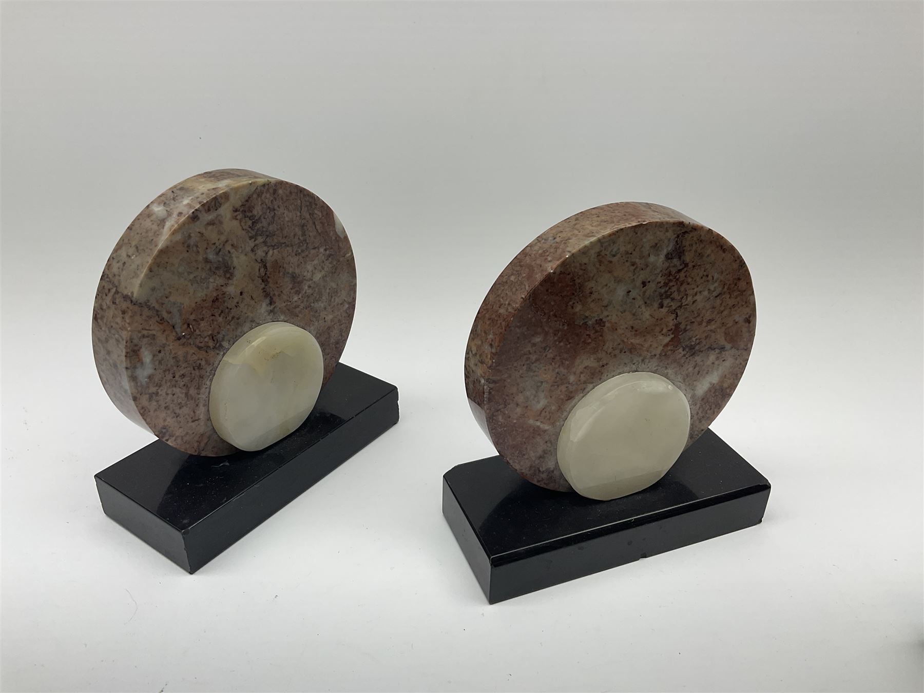 Art Deco style marble and anodised spelter three-piece clock garniture, model with recumbent gazelle, centre piece L52cm.  