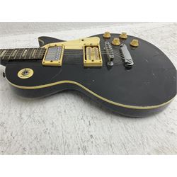 Stagg heavy metal style six-string electric guitar, finished in black with chrome tuning pegs, fret markers and humbucker pickups to bridge L106cm; and Hondo USA electric guitar with black body, ivory coloured pickguard and mother-of-pearl fretmarkers L101cm (2)   