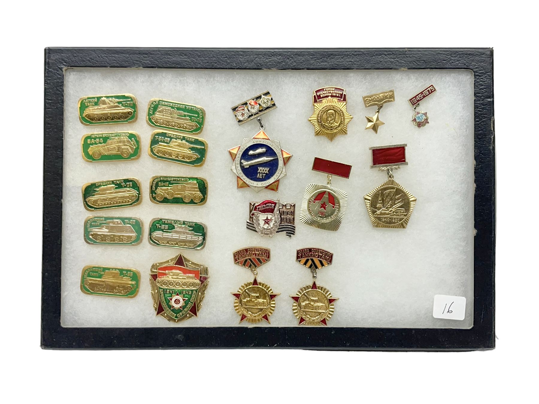 Nineteen Russian Soviet Tank Commemoration badges and medals, in small display case
