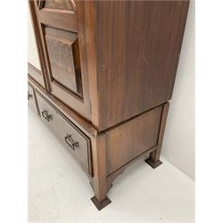 Large late Victorian walnut wardrobe, projecting cornice of central bevelled mirror and two panelled doors, two drawers to base