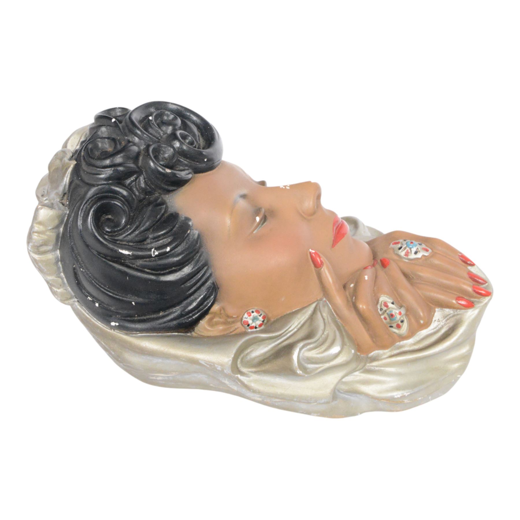 Art Deco style plaster wall mask, depicting a woman in a silver headdress with red lips and nails, H33cm
