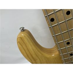 Ernie Ball Music Man Sting Ray 4 string bass guitar, in natural finish with roasted maple neck and tortoiseshell effect scratch guard, serial no 87485, in black Music Man hard case, guitar L114cm