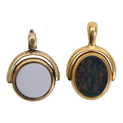 Two 19th century gold swivel fobs, the first 18ct example set with bloodstone and carnelian engraved with monogram and armorial, bearing hallmarks, the second 9ct example with bloodstone and chalcedony, set within simple mounts, each approximately H3cm 

Provenance: By family descent from the Chichesters of Arlington Court, Devon; from the collection of Andrew Chichester Everitt.
