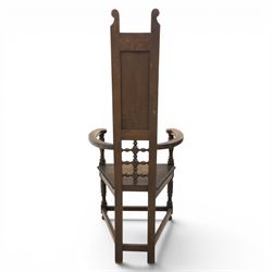 Manner of Liberty & Co. - Arts & Crafts oak Shakespeare chair, high back over triangular seat, flanked by swept arms, raised on turned and block supports united by stretchers