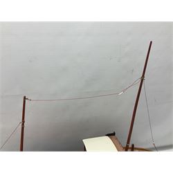 Model two masted fishing boat, on wooden stand, with a HiTec Ranger II N remote control, untested