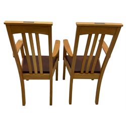 Pair of solid oak Arts and Crafts style carver chairs, inlay to top rail, drop in seat