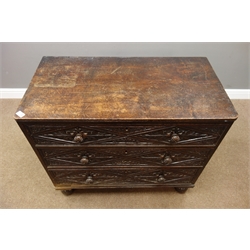  19th century oak three drawer chest, drawer fronts carved with foliage lozenges, on bun feet, W97cm, H84cm, D51cm  