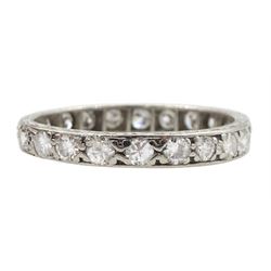 Early-mid 20th century platinum channel set diamond full eternity ring, the band with engraved decoration, total diamond weight approx 0.90 carat