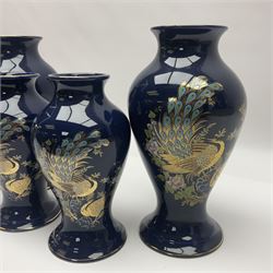 Two pairs of Royal Winton vases, decorated with peacocks on a blue ground, largest H24cm