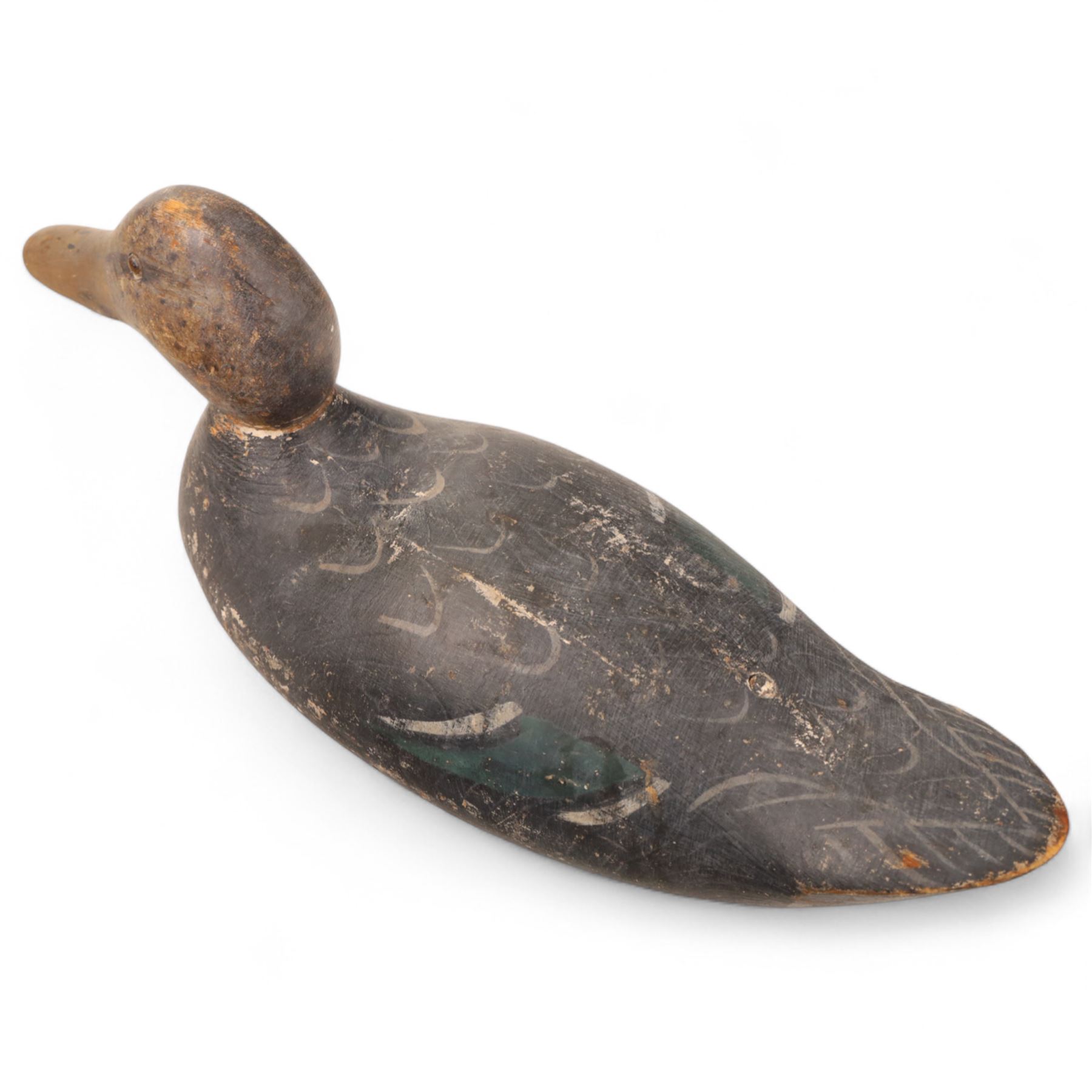 Early 20th century American carved wooden decoy duck, with weight beneath marked CJ Raymond Lead Co Chicago, H19cm, L40cm
