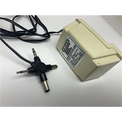 Sinclair ZX Spectrum (1984) with accessories and games; ten games for Sinclair Spectrum and 48K Spectrum to include ‘Knight Lore’, ‘The Way of the Exploding Fist’, and ‘Green Beret’ all in original boxes, ‘Rambo First Blood Part II’ without original box; Sinclair UK1400 Power Supply Unit, Hales Universal Mains Adapter, RAM Turbo Spectrum Joystick Interface, Starlite Cassette Player, all without boxes