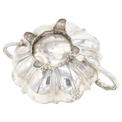 William IV silver twin handled sucrier and milk jug, each of circular bellied form, embossed with floral decoration, upon four pad scroll feet, hallmarked London 1831, maker's marks CE, including handles H10cm