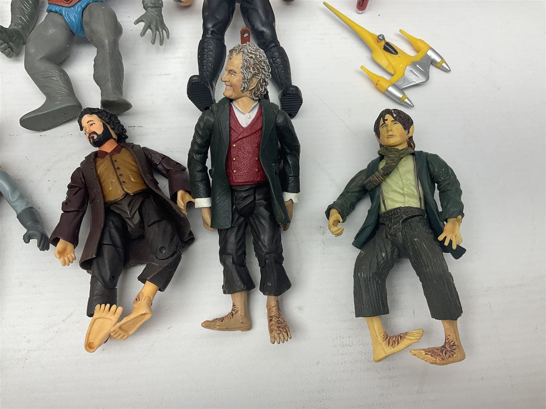Collection of 80s-00s collectable figures from Lord of the Rings, Masters of the Universe, Thunderbirds etc