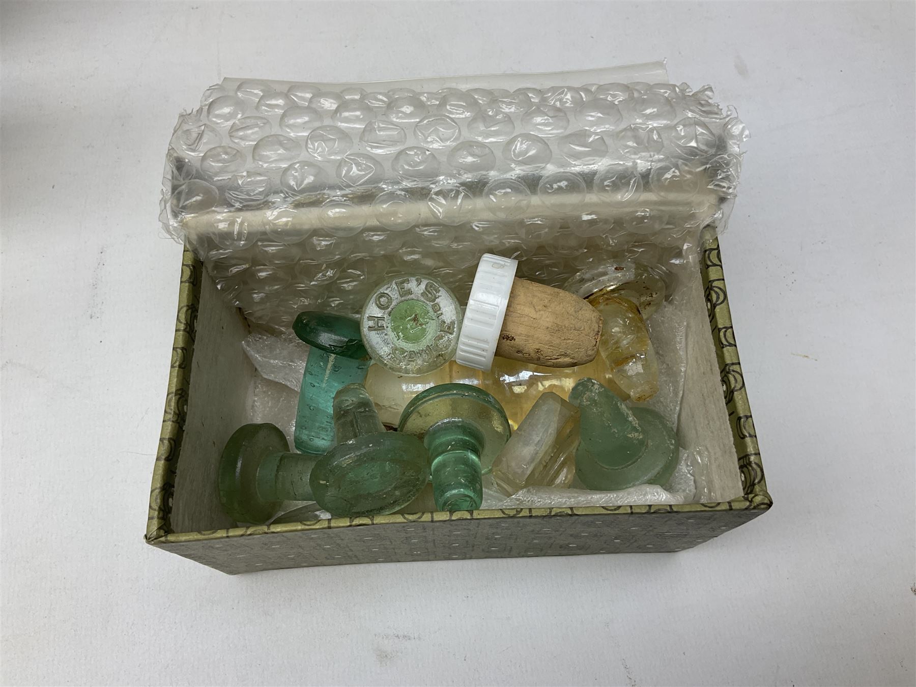 Collection of various vintage glass bottles and stoppers, including advertising bottles, sauce bottles and medical bottles etc