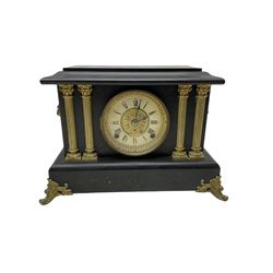 Seth Thomas - American 8-day late 19th century faux slate mantle clock, wooden case with a flat top, decorative gilt metal columns, lion heads and splayed feet,  two part dial with a gilt centre and Roman numerals to the chapter, within an ornate glazed bezel, twin train spring driven movement striking the hours on a coiled gong and the half hours on a bell. 