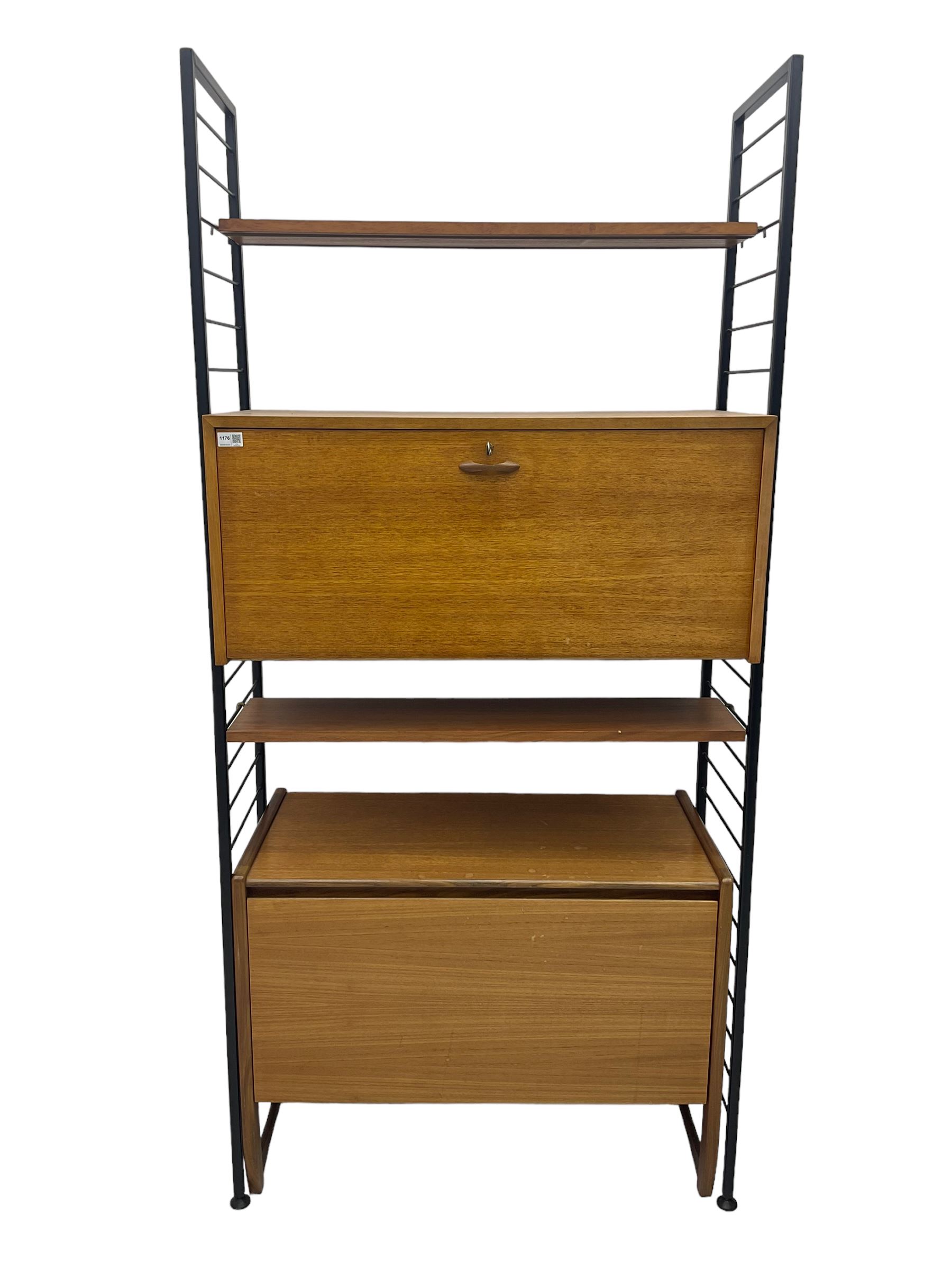 Staples Ladderax - mid-20th century teak and metal framed modular wall unit, fitted with central fall-front cupboard enclosing correspondence dividers, over secondary separate teak fall-front cupboard, adjustable shelf to top