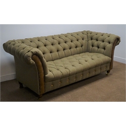  Large two seat Chesterfield style sofa, upholstered in Scottish wool tweed with leather fascias, turned supports on brass castors, W200cm  