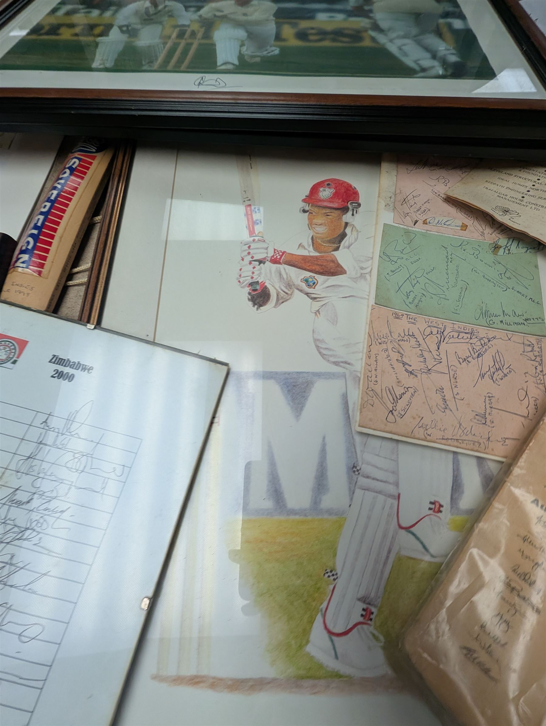 Collection of signed International cricket memorabilia, mostly relating to West Indies, including Curtly Ambrose and Brian Lara prints, Shane Warne and Glen McGrath last test souvenirs, signed Zimbabwe 2003 tour cricket bat, etc