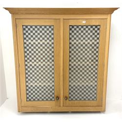 Smallbone light oak bookcase, projecting cornice above two chequered opaque glazed doors enclosing three adjustable shelves