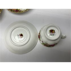 Royal Albert Country Roses pattern tea service for six, comprising Teapot, open sucurer, milk jug, cups and saucers, dessert plates and cake stand 