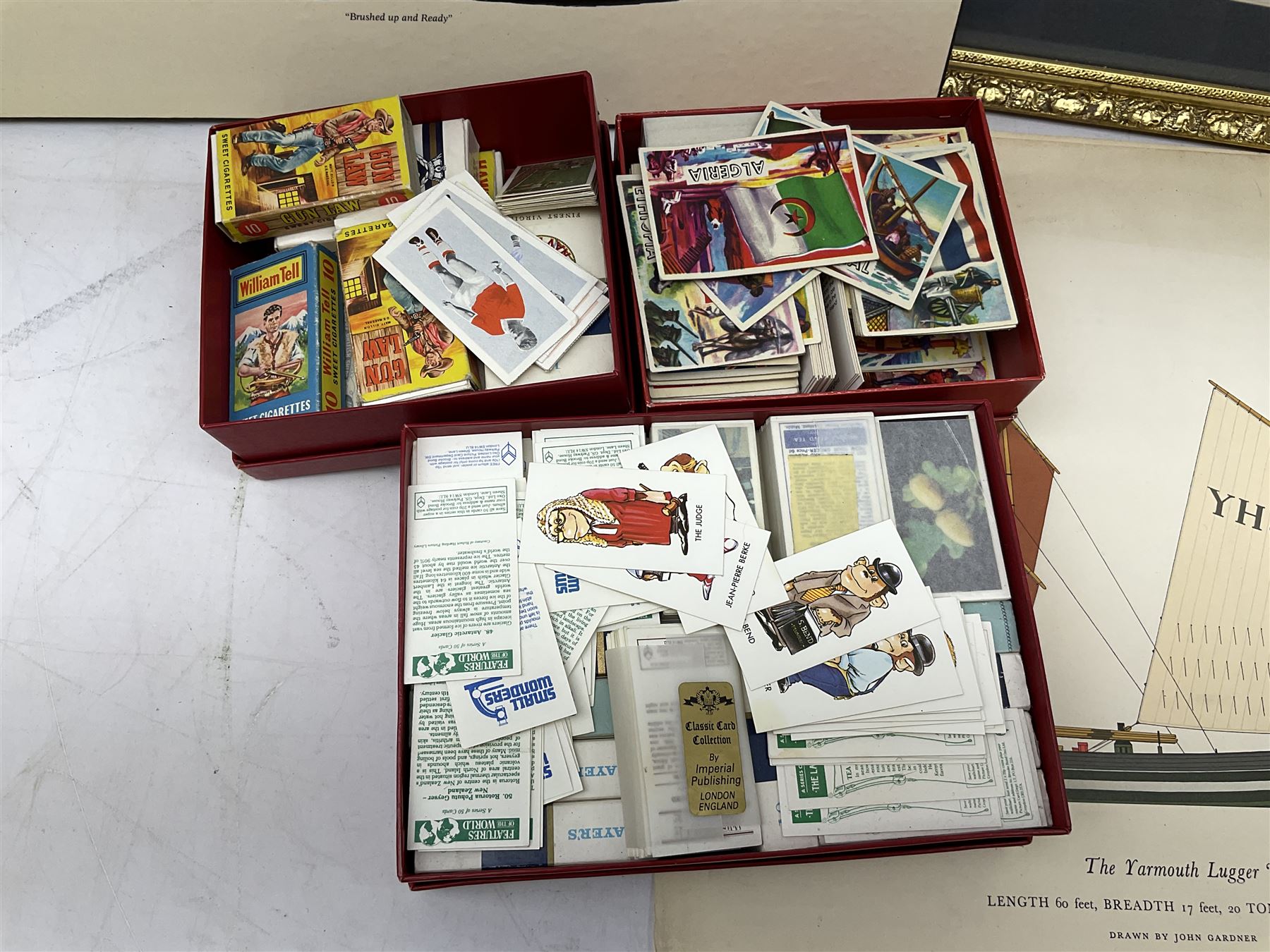 Set of four framed coloured prints humorous fire brigade related, after Chris Reynolds, together with Brooke bond picture cards, to include Asian wild life, the race into space, travel through the ages etc