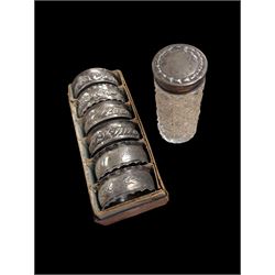 Six silver napkin rings, together with a silver topped cut glass jar, all hallmarked