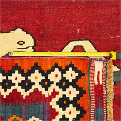 Southwest Persian Qashqai kilim, flatwoven wool with central pictorial design of mirrored horses on a red ground, framed by multicoloured motifs and stepped ivory border, vibrant palette throughout