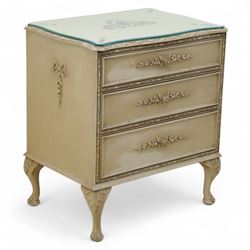 French design cream painted three drawer commode, shaped front with floral garland appliqu...