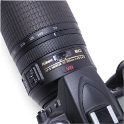 Nikon D90 DSLR camera body, serial no. 8230680, with a Nikon ED AF-S Nikkor 70-300mm 1:4.5-5.6 G lens, serial no. 3102829, with battery and Nikon Quick Charger, in carry case with other accessories including hoods, caps and filters