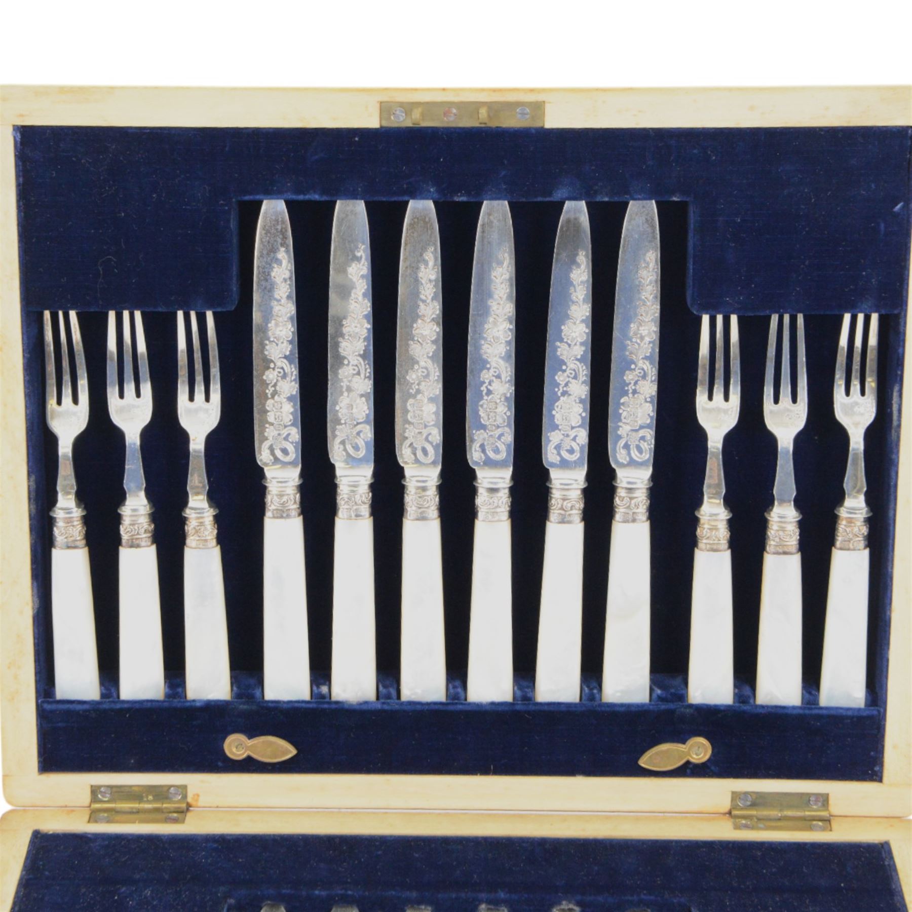 Set of twelve mother of pearl handled silver fruit knives and forks, the knives with floral engraving to blades, hallmarked to both collars and blades/prongs, Frederick C Asman & Co, Sheffield 1906, contained within fitted wooden case with velvet lined interior