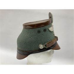 WW2 German rural police shako with helmet plate and liner; bears label 'Hans Romer Echt Fiber-Tschako Neu-Ulm (Donau)'