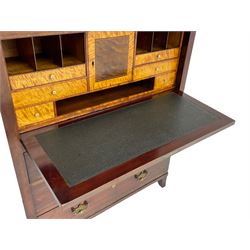 Early to mid-19th century figured mahogany Continental secrétaire à abattant, stepped top fitted with single cupboard, inlaid with oval figured amboyna panels, the fall front inlaid with shell motif enclosing a satinwood interior fitted with cupboard, drawers, and pigeon holes, three long drawers below, on square tapering feet