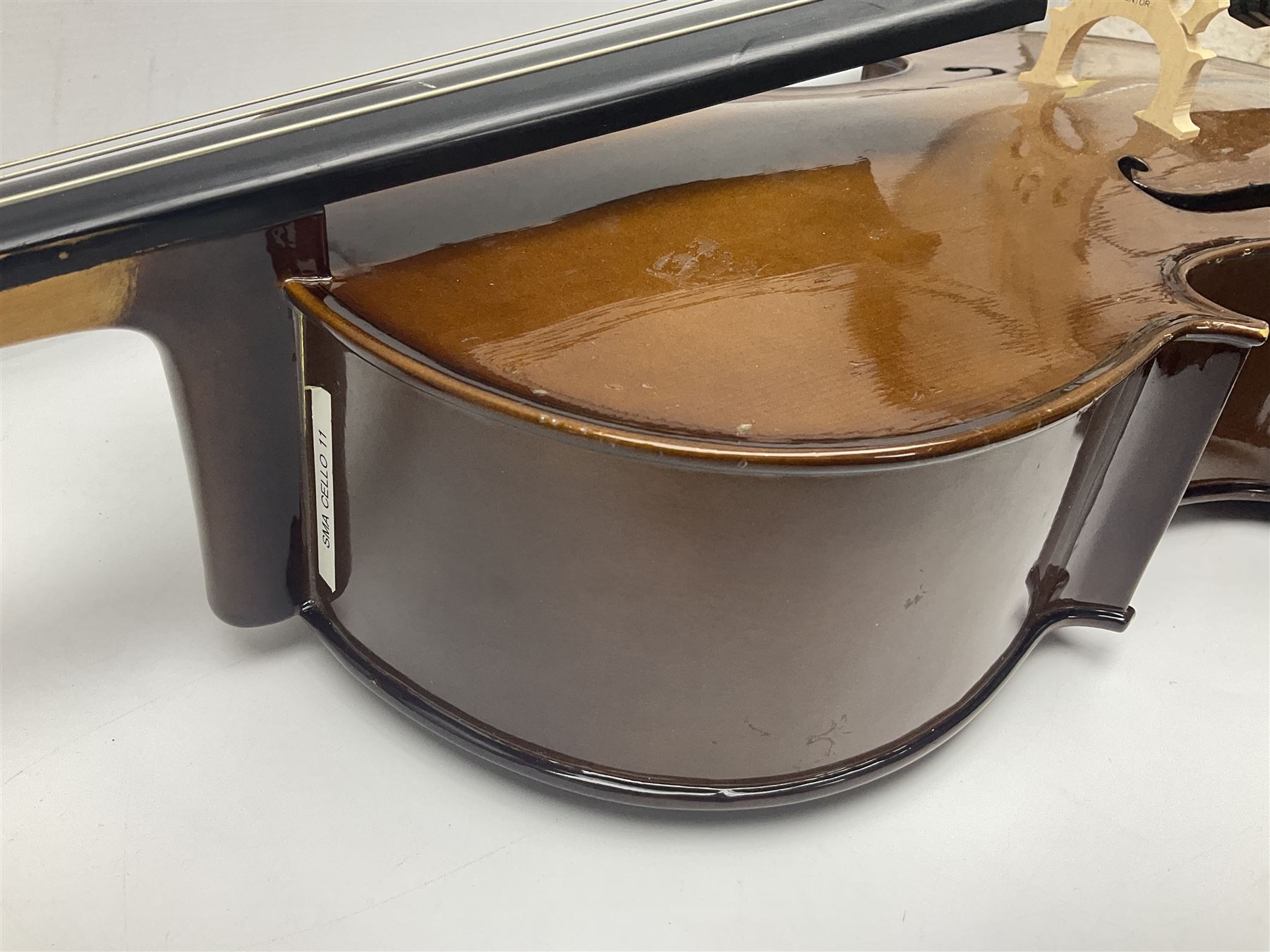 Stentor Student I quarter-size cello with 59.5cm two-piece maple back and ribs and spruce top; bears maker's label with serial no.M076096 L95.5cm overall; in Stentor soft carrying case with bow