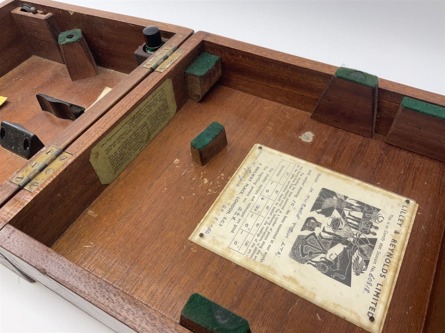 Henry Hughes & Son Ltd. sextant with black crackled finish, brass and silvered graduated arc and various coloured glass filters, serial no.60818, in fitted mahogany carrying box bearing Lilley & Reynolds Ltd. certificate dated 1962 W26cm