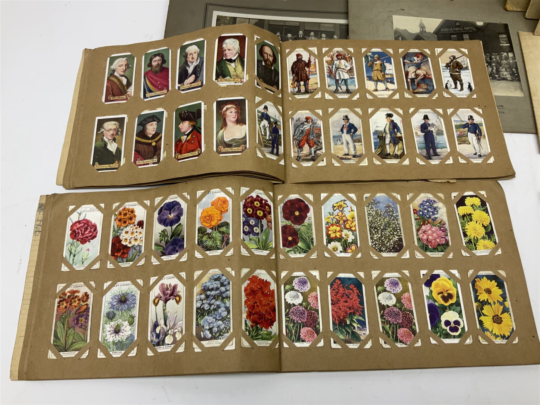 Two albums of cigarette cards, including Carreras Alice in Wonderland examples, together with vintage greetings cards, postcards, theatre stills, etc