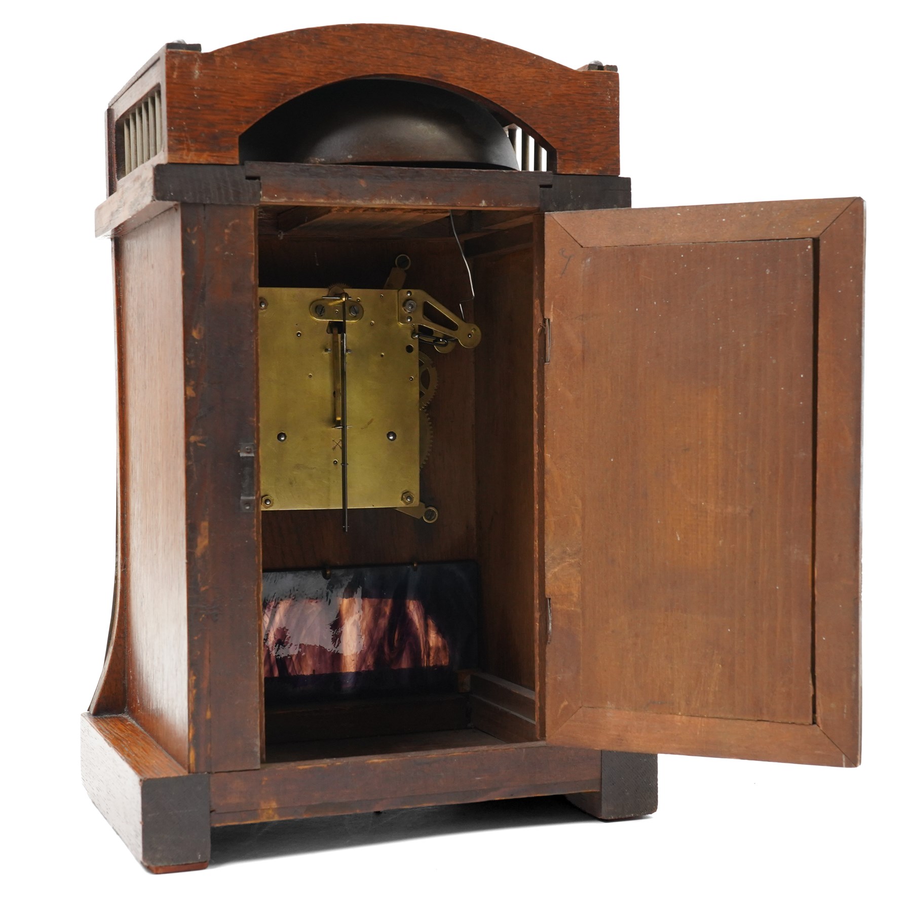 Arts and Crafts oak and brass mounted mantel clock, Hamburg-American Clock Company (HAC), for Liberty & Co, the eight day movement with bell strike, repousse dial with Arabic numerals H36.5cm

  