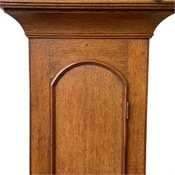 William Gostling of Diss  (Norfolk)-  Late 18th century 8-day oak longcase clock c1780-90, break arch top with scalloped cresting and three brass finials, glazed break arch hood door flanked by turned pilasters with brass capitals, trunk with a long trunk door and rounded top on a square plinth with an applied and shaped skirting, early painted Wilson of Birmingham dial with Roman numerals and five minute Arabic's, matching steel hands and second pointer, arched square ended calendar aperture with date disc behind, floral spandrels within gesso borders and a painted rocking automaton representing Mercury to the break arch, dial pinned via a false plate to a weight driven rack striking movement with a recoil anchor escapement, striking the hours on a cast bell. With pendulum weights and key. 
William Gostling (II) is recorded as working in Diss from 1774 to 1797, succeeded by widow Anne and son George . The dial of this clock is illustrated and discussed in detail in M.F. Tennants book 